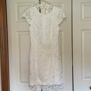 Lulu’s white lace backless dress.